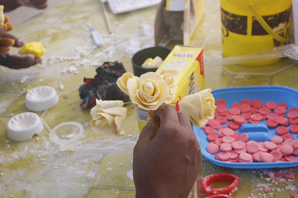 Students practicing cake decoration techniques in culinary class